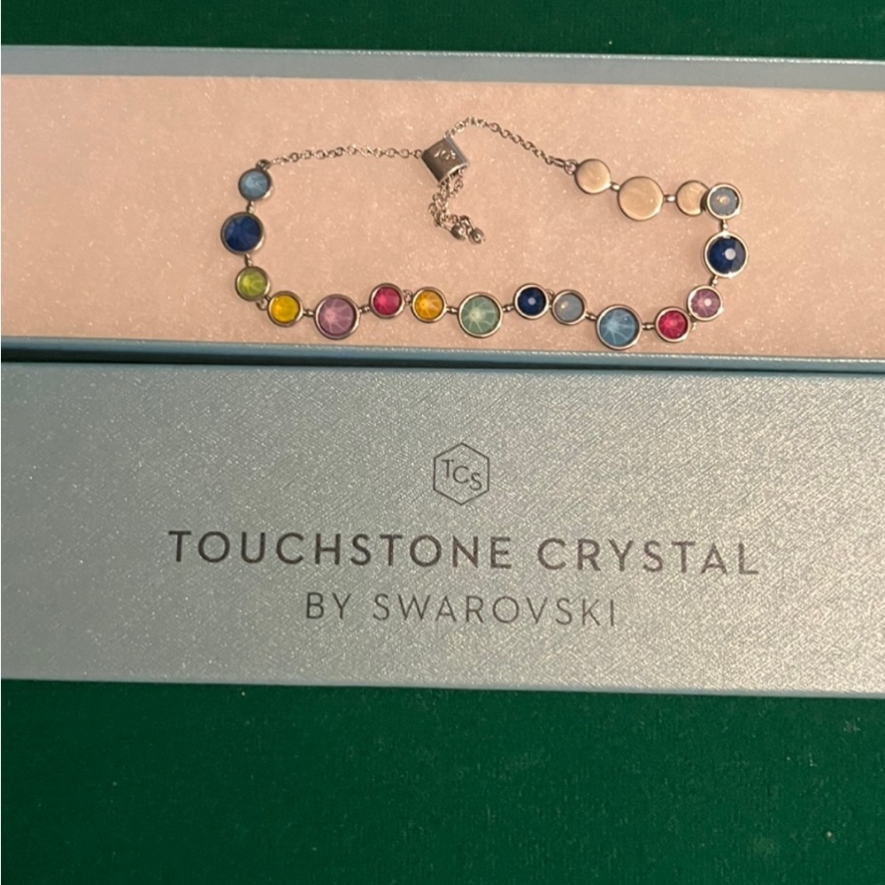 Beautiful adjustable, tri-colored bracelet its touchstone crystal by SWAROVSKI.